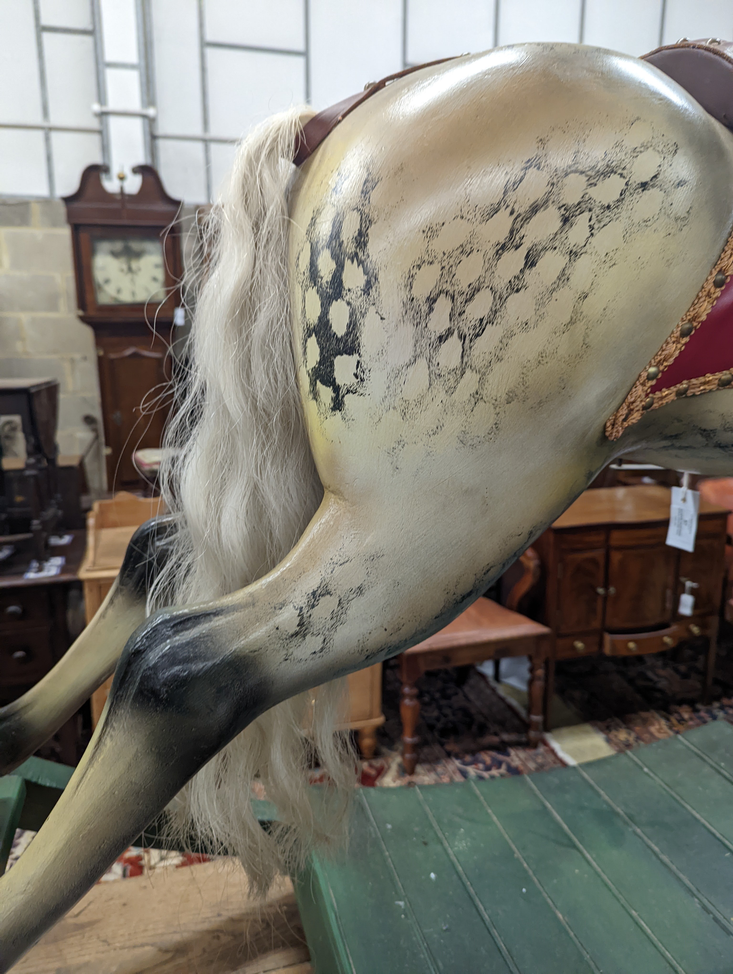 A large Victorian style painted rocking horse with end seats, length 240cm, height 132cm